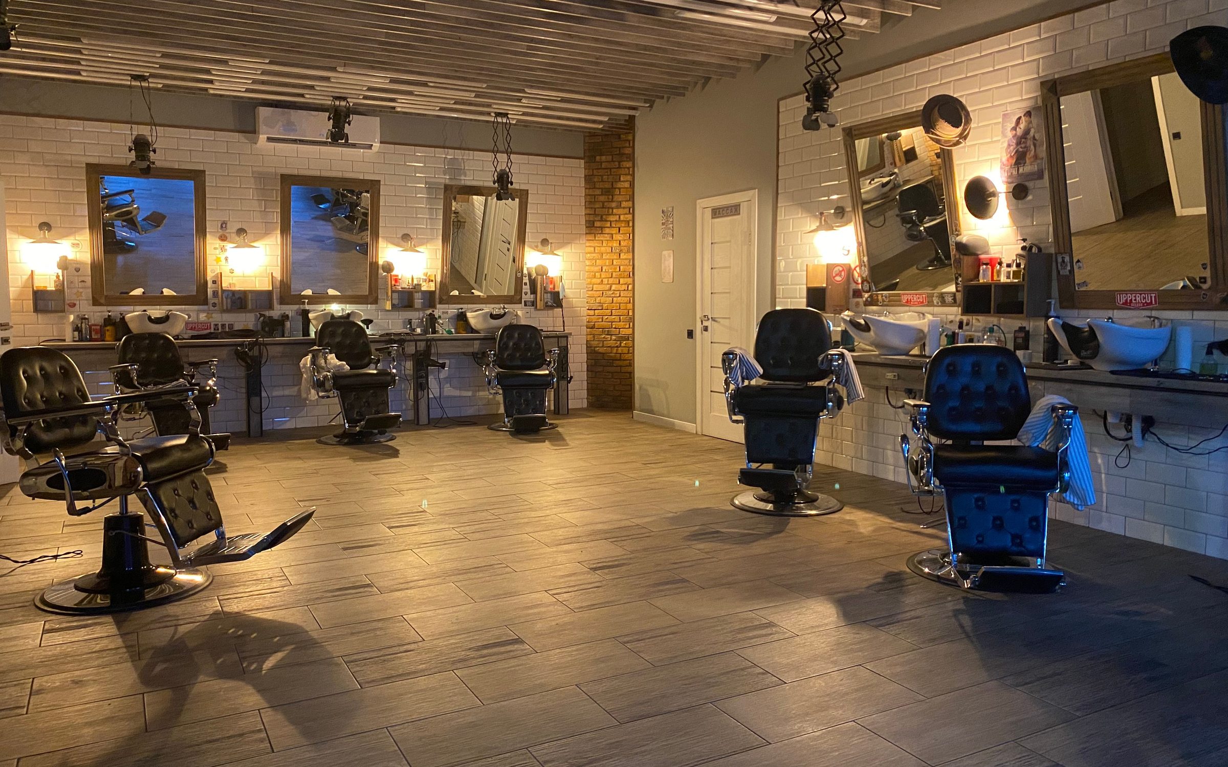 Barbershop floor with chairs, mirrors and stations